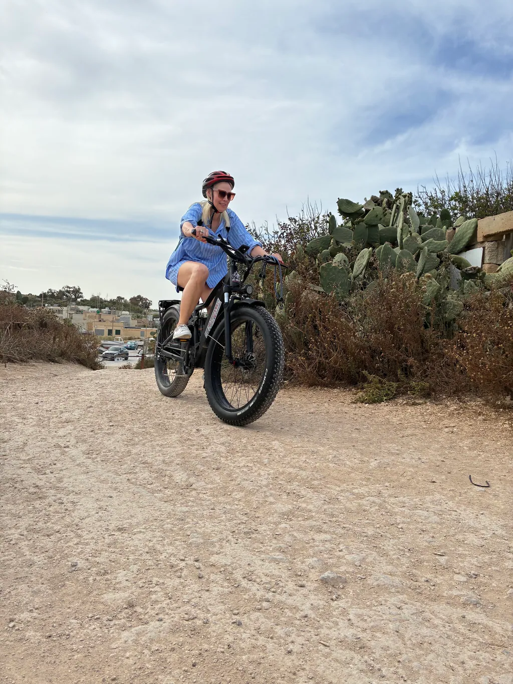 Rider on a Los Arditos fat-tyre e-bike on a coastal trail in Malta