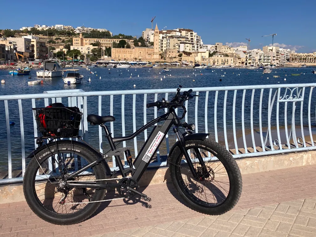 E-bike on the Sliema seafront with the Valletta skyline across the harbour